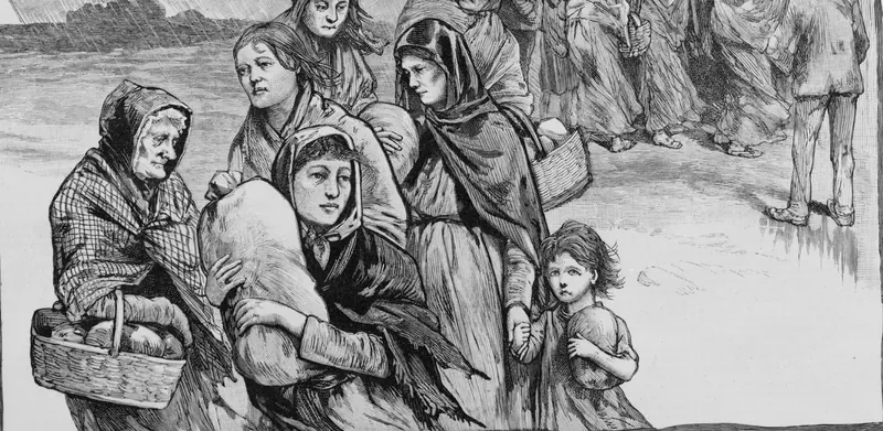 A wood engraving of women in shawls and a small girl carrying sacks and baskets of bread through the rain, while a line of women waits at the door of a wooden building behind them.